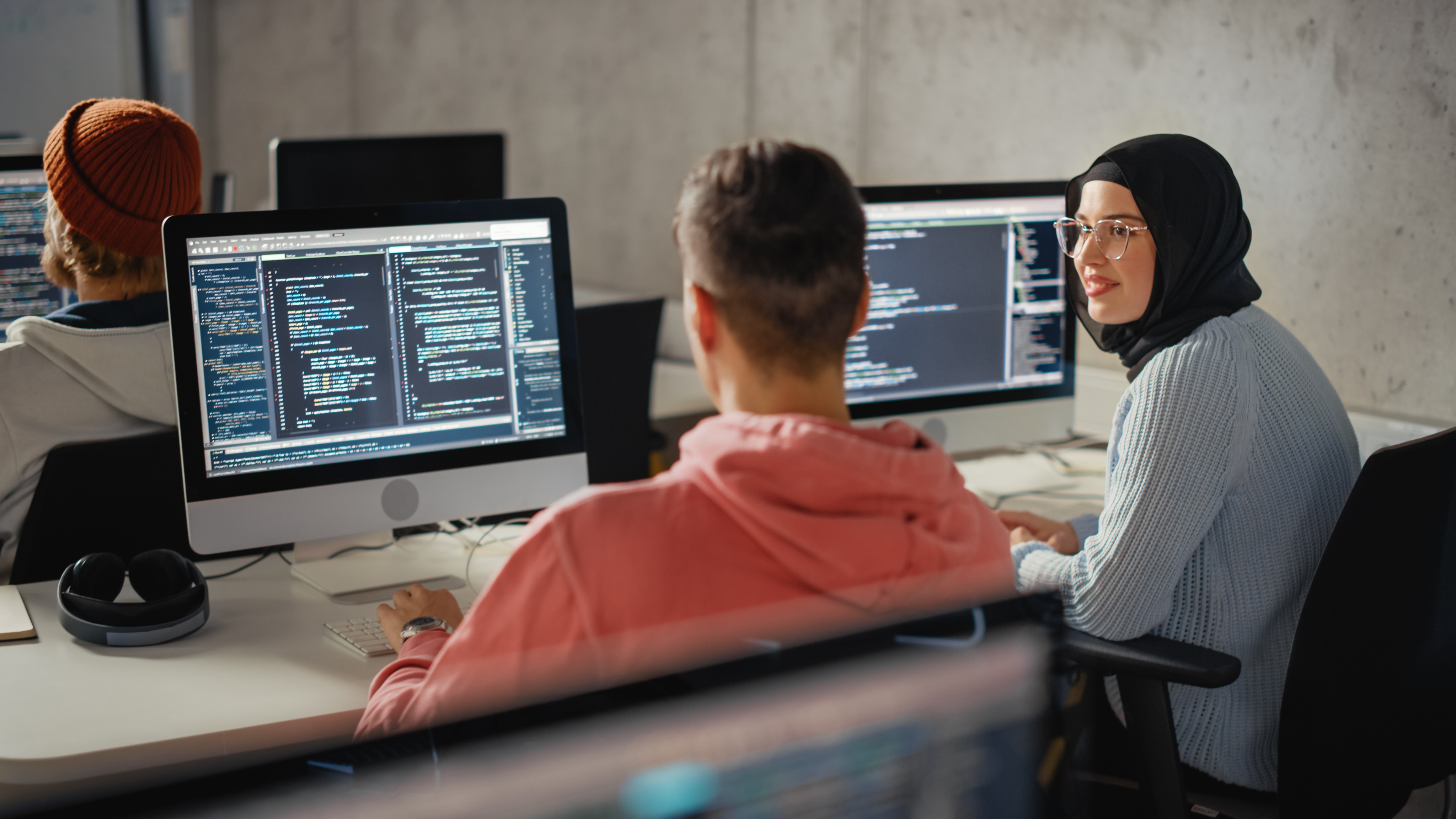 Portrayal of Capella University online Information Technology students using computers. 