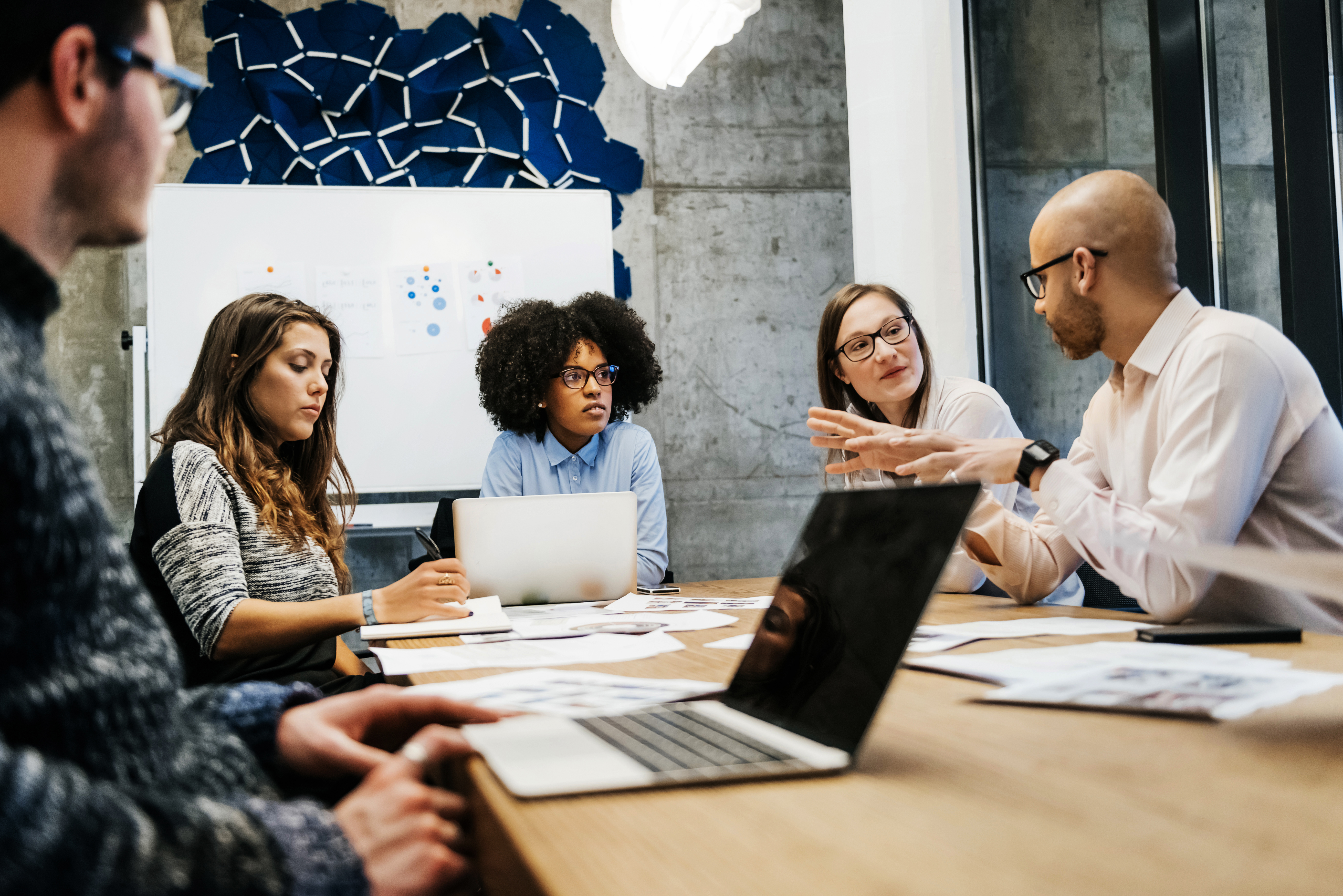 Portrayal of Capella business student communicating with their team
