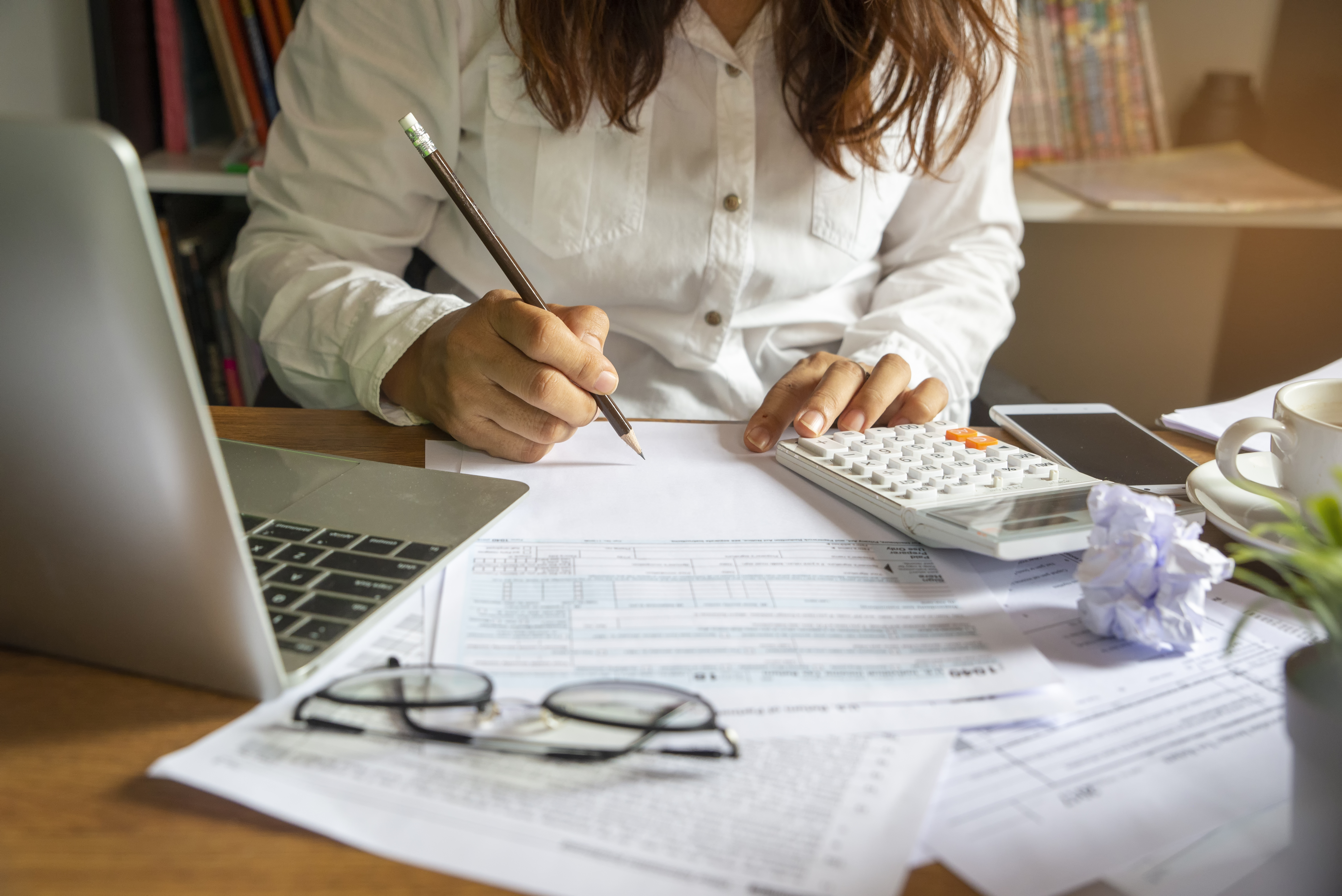 Portrayal of Capella student calculating tuition costs