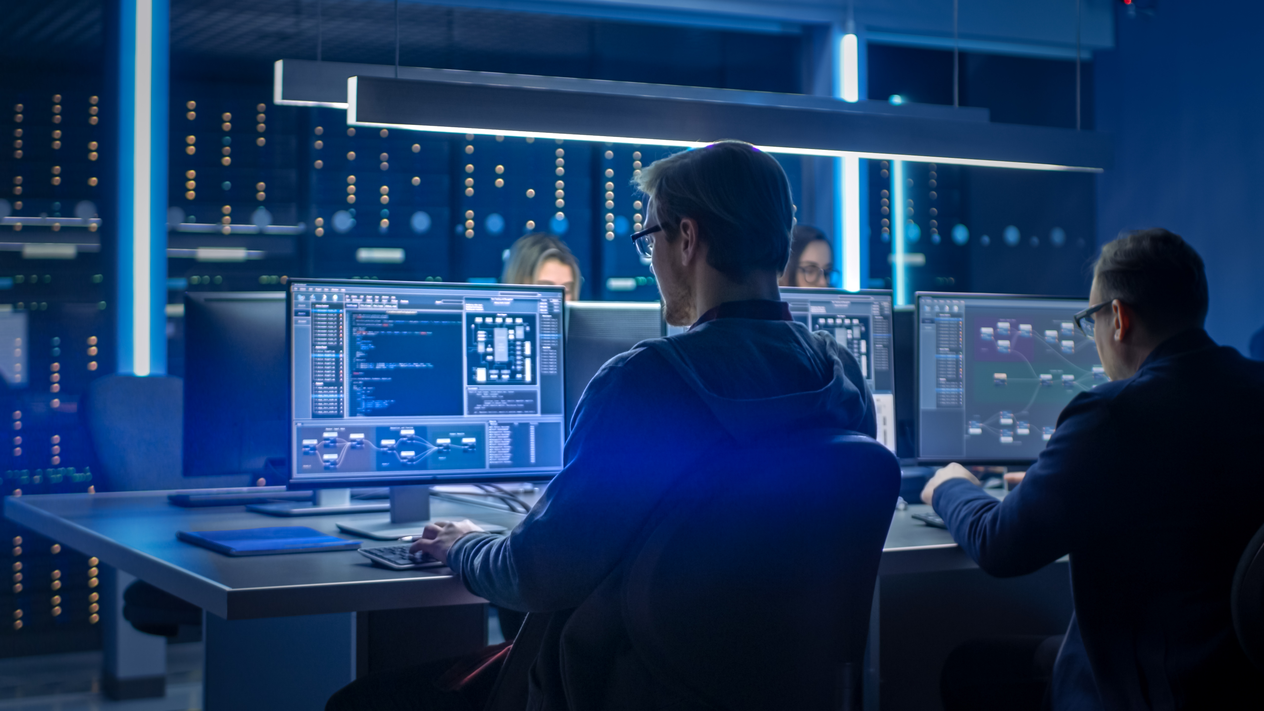 Portrayal of Capella IT student in cybersecurity environment.