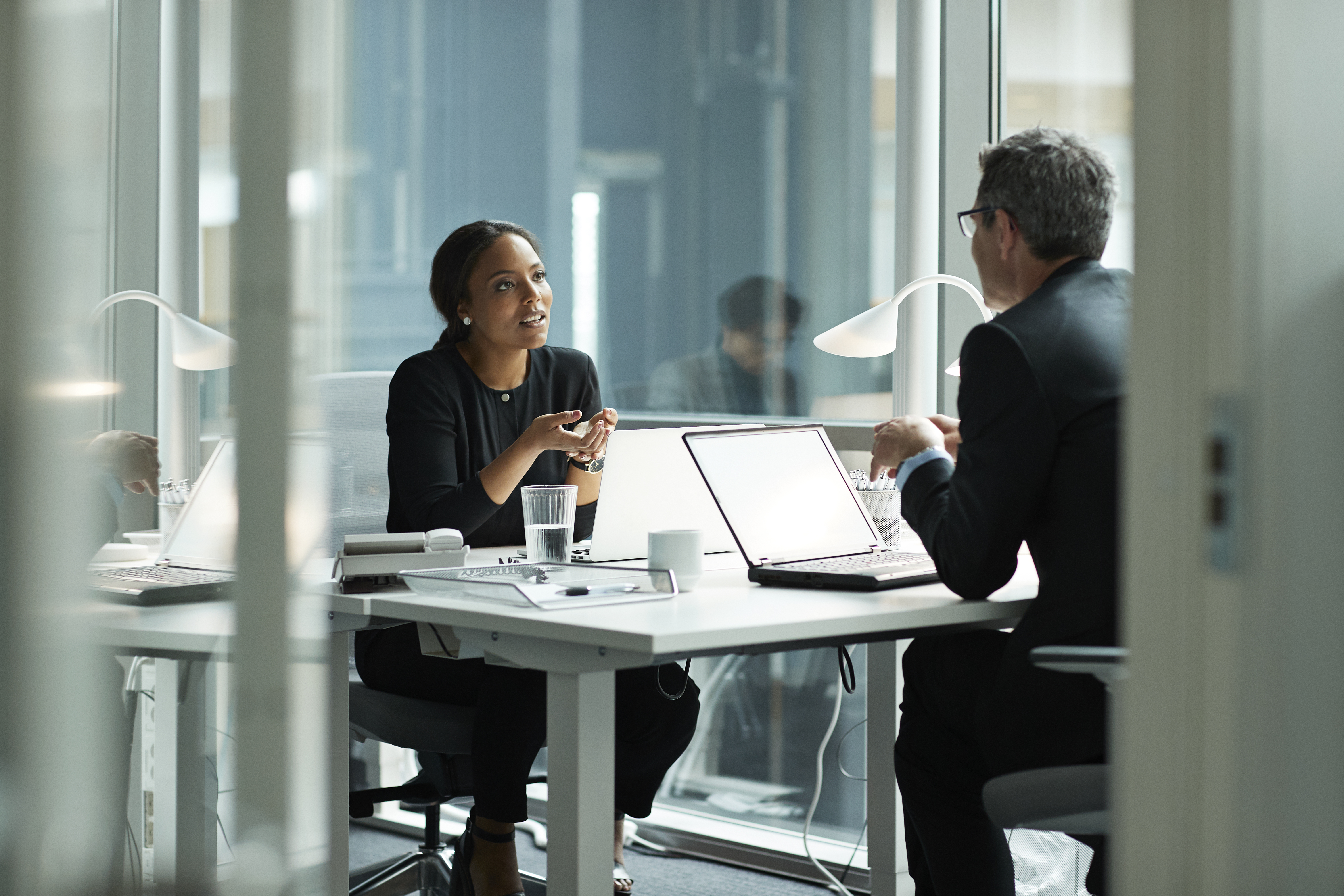 Portrayal of Capella human resource management student meeting with colleague
